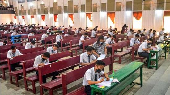 Dimapur: Students appear in their High School Leaving Certificate (HSLC) exam for the Nagaland Board of School Education (NBSE), amid coronavirus pandemic, in Dimapur, Wednesday, April 07, 2021. (PTI Photo)(PTI04_07_2021_000086A) (PTI) Dimapur: Students appear in their High School Leaving Certificate (HSLC) exam for the Nagaland Board of School Education (NBSE), amid coronavirus pandemic, in Dimapur, Wednesday, April 07, 2021. (PTI Photo)(PTI04_07_2021_000086A) (PTI)