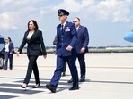 United States Air Force Lt. Col. Neil Senkowski escorts Vice President Kamala Harris after she deplaned Air Force Two when a technical issue forced the aircraft to return and land at Andrews Air Force Base, Md.(AP)