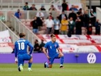 England's Kalvin Phillips and Jack Grealish kneel in support of the Black Lives Matter campaign before the match