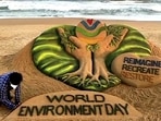 Sand Artist Sudarsan Pattnaik makes a sand art messaging 'Reimagine, Recreate and Restore the environment on the occasion of World Environment Day, in Puri on Saturday. (ANI Photo)(ANI) Sand Artist Sudarsan Pattnaik makes a sand art messaging 'Reimagine, Recreate and Restore the environment on the occasion of World Environment Day, in Puri on Saturday. (ANI Photo)(ANI)