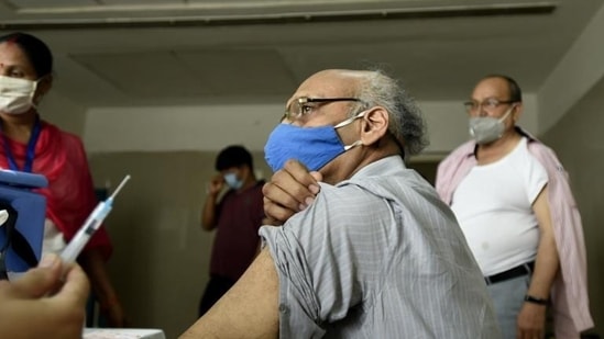 An elderly man gets vaccinated against Covid-19 at sector 30 district hospital, in Noida, Uttar Pradesh. (HT file photo)