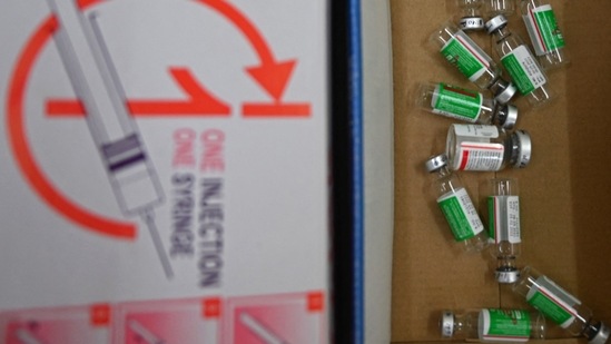 Empty vials of the Covishield Covid-19 vaccine are pictured during a vaccination drive being held at a civil hospital in Jind on June 1. As many as 23,13,22,417 doses of Covid-19 vaccines have been administered so far across the country. (Money Sharma / AFP)