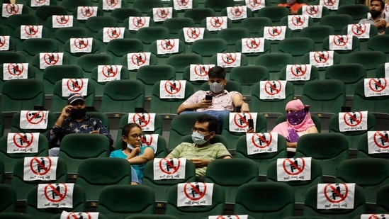 People sitting in an observation area after receiving a vaccine for Covid-19 in Ahmedabad on June 5. India’s active caseload of cases has also dropped to below 15 lakh cases as of the latest update. (Ajit Solanki / AP)