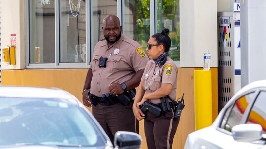 Miami-Dade Police officers are shown outside a Shell gas station near the scene of a shooting in Miami, Florida.(AP) Miami-Dade Police officers are shown outside a Shell gas station near the scene of a shooting in Miami, Florida.(AP)