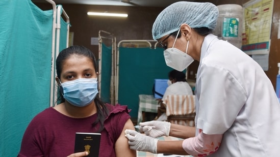 A healthcare worker administers a dose of Covid-19 vaccine to a girl, during a special vaccination drive for students travelling abroad for higher education, on Saturday. (PTI Photo) A healthcare worker administers a dose of Covid-19 vaccine to a girl, during a special vaccination drive for students travelling abroad for higher education, on Saturday. (PTI Photo)