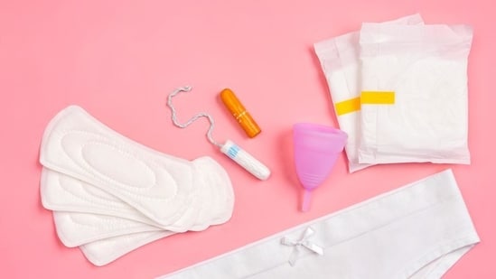 A range of period products displayed, from sanitary napkins, to tampons to more sustainable options like the menstrual cup.