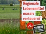 A poster stands in front of a field before a vote on agrarian initiatives to curb the use of pesticides, near Ellikon an der Thur, in Switzerland on May 27, 2021. 