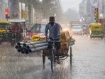 A man rides a cart during heavy rainfall on Friday. (ANI Photo) A man rides a cart during heavy rainfall on Friday. (ANI Photo)
