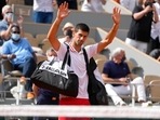 Serbia's Novak Djokovic waves to the crowd after Italy's Lorenzo Musetti retired from the match in their fourth-round Serbia's Novak Djokovic waves to the crowd after Italy's Lorenzo Musetti retired from the match in their fourth-round
