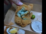 The image shows the deep fried towel delivered instead of the fried chicken.(Facebook/@Alique Perez) The image shows the deep fried towel delivered instead of the fried chicken.(Facebook/@Alique Perez)