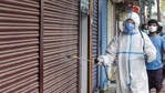 A man wearing protective gear sprays disinfectant after the government eased Covid-19 induced lockdown restrictions on June 6, 2021. (PTI) A man wearing protective gear sprays disinfectant after the government eased Covid-19 induced lockdown restrictions on June 6, 2021. (PTI)