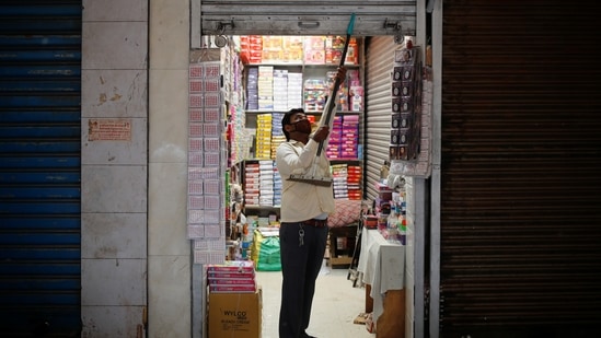 A shopkeeper opens his store in a market area after authorities eased Covid-19 lockdown restrictions that were imposed to slow down the spread of the coronavirus in New Delhi on June 7. Several parts of the country resumed activities on June 7 as part of the gradual easing of a lockdown that had been imposed two months ago to check the second wave of infections. (Adnan Abidi / REUTERS) A shopkeeper opens his store in a market area after authorities eased Covid-19 lockdown restrictions that were imposed to slow down the spread of the coronavirus in New Delhi on June 7. Several parts of the country resumed activities on June 7 as part of the gradual easing of a lockdown that had been imposed two months ago to check the second wave of infections. (Adnan Abidi / REUTERS)