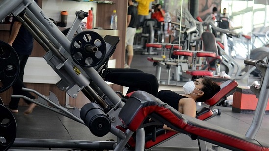 People working out in a gymnasium in Mumbai on June 7. Mumbai falls in level-3 where all shops can open, restaurants can serve customers till 4pm on weekdays, private offices can be reopened with 50% staff, also till 4pm, and people can go for jogging and to gymnasiums, with certain conditions. (Sujit Jaiswal / AFP) People working out in a gymnasium in Mumbai on June 7. Mumbai falls in level-3 where all shops can open, restaurants can serve customers till 4pm on weekdays, private offices can be reopened with 50% staff, also till 4pm, and people can go for jogging and to gymnasiums, with certain conditions. (Sujit Jaiswal / AFP)