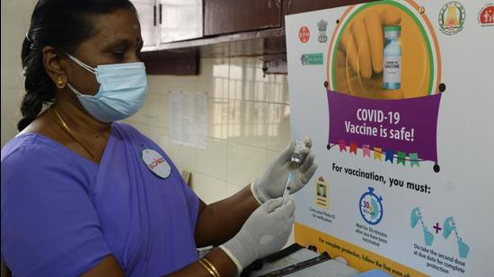 A health official prepares a vaccine kit as she takes part in a mock drill for Covid-19 vaccine delivery at a primary health centre in Chennai in January this year. (File photo) A health official prepares a vaccine kit as she takes part in a mock drill for Covid-19 vaccine delivery at a primary health centre in Chennai in January this year. (File photo)