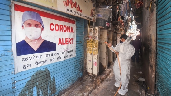 A worker sanitises at Sadar Bazar market area on Sunday ahead of its reopening, as part of Delhi government's order of gradual unlocking of Covid-induced restrictions. (PTI Photo) A worker sanitises at Sadar Bazar market area on Sunday ahead of its reopening, as part of Delhi government's order of gradual unlocking of Covid-induced restrictions. (PTI Photo)