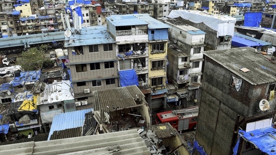 Rescue and relief work underway after a portion of a four-storey building collapsed on another house, at Rajjak Chawl in Kherwadi, Bandra (east) in Mumbai, Monday, June 7, 2021. (PTI)