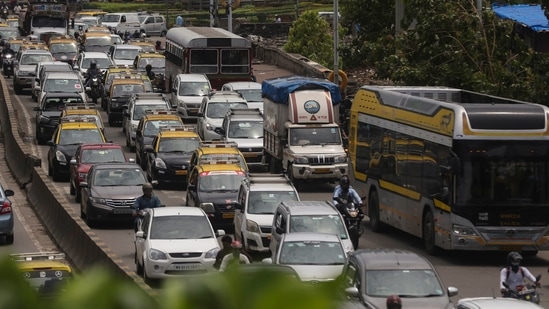 Traffic is seen on the road in Mumbai on June 7. Maharashtra also began unlocking in a graded manner from today as the state’s five-level plan to ease curbs came into effect. The lockdown was imposed in the state in April following the devastating second Covid-19 wave. (Rafiq Maqbool / AP) Traffic is seen on the road in Mumbai on June 7. Maharashtra also began unlocking in a graded manner from today as the state’s five-level plan to ease curbs came into effect. The lockdown was imposed in the state in April following the devastating second Covid-19 wave. (Rafiq Maqbool / AP)
