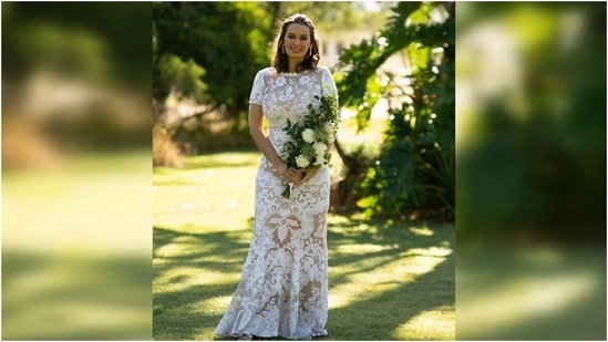 Evelyn wore the gown with minimal accessories. She opted for shiny stone-encrusted earrings to go with her wedding dress. She tied her short wavy locks in a half-tied hairdo. With shimmery pink eye shadow, mascara-laden eyelashes, a light hint of blush on the cheeks and nude pink lipstick, she completed her make-up.(Instagram/@evelyn_sharma)