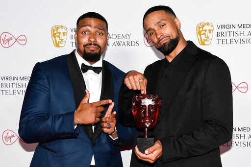 Jordan Banjo, left, and Ashley Banjo pose for photographers with their Must See Moment award in 'Britain's Got Talent' backstage at the British Academy Television Awards in London, Sunday, June 6, 2021. (AP)