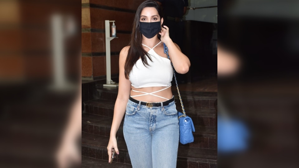 Nora Fatehi pairs ₹4 lakh bag with chic white crop top and denims, see pics