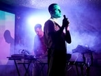 Musician Iacopo Bertelli, front, stage name Jack Milwaukee, and Francesco Perini, stage name Pearz, at keyboards, play live on stage in front of a socially distanced crowd at the Moth Club in Hackney, London on May 30. Jack Milwaukee told AP his inspiration to create new music was reduced to zero during the pandemic but returned once the road map for reopening was clear.(Alberto Pezzali / AP)