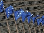 European Union flags flutter outside the EU Commission headquarters in Brussels, Belgium.