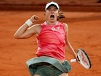Poland's Iga Swiatek celebrates winning her fourth round match against Ukraine's Marta Kostyuk.