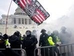 US Capitol Police officers hold off rioters loyal to President Donald Trump at the Capitol in Washington.