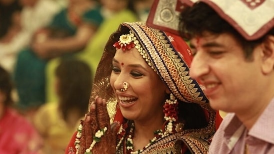 Rupali Ganguly with her husband Ashwin K Verma at her godhbharai ceremony.