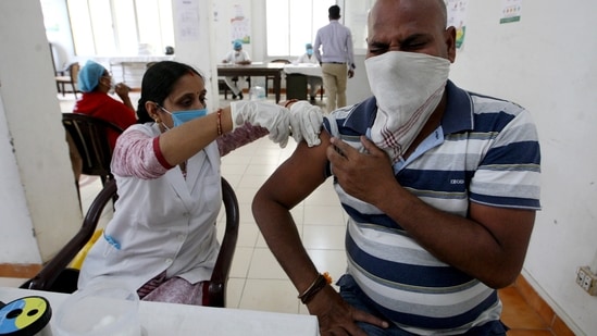 A health worker administers a dose of Covid-19 vaccine to a man. (ANI/ For Representative Purposes Only) A health worker administers a dose of Covid-19 vaccine to a man. (ANI/ For Representative Purposes Only)