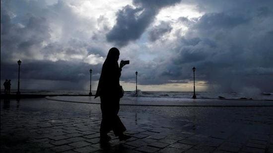 FILE PHOTO: A woman takes photographs with her mobile phone against the backdrop of monsoon clouds at a beach in Kochi, India June 8, 2019. REUTERS/Sivaram V/File photo (REUTERS) FILE PHOTO: A woman takes photographs with her mobile phone against the backdrop of monsoon clouds at a beach in Kochi, India June 8, 2019. REUTERS/Sivaram V/File photo (REUTERS)