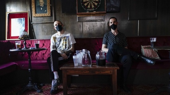 Musicians Iacopo Bertelli, left, and Francesco Perini, pose backstage at the Moth Club in Hackney, prior to their live show on stage, in London on May 30. The pair performed last week in London, playing a series of four socially distanced shows in three days to a crowd that averaged 70.(Alberto Pezzali / AP)