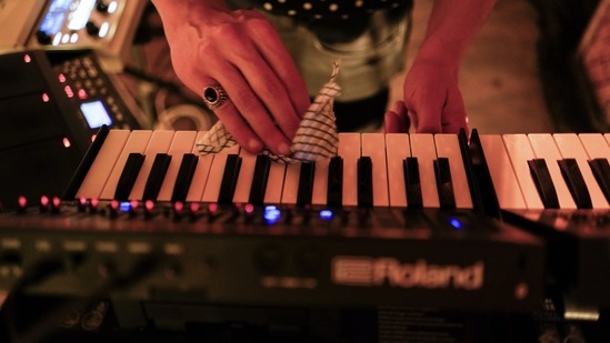 Musician Francesco Perini, sanitizes his keyboards prior to a live socially distanced performance at the Moth Club in Hackney, in London on May 30. Perini, like Milwaukee is an Italian based in London, also has a fulltime job at an optician's shop. After being furloughed and finding himself at home with too much free time, he told AP he started seeking solace from alcohol.(Alberto Pezzali / AP)