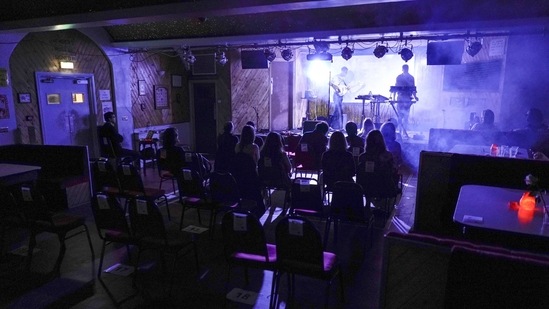 Iacopo Bertelli and Francesco Perini play in front of a socially distanced crowd at the Moth Club in Hackney, London on May 30. During the second part of 2020, Perini, an experienced musician and member of Italian psychedelic rock band The Hacienda turned some ideas into music. He said the process, spending up to eight hours a day writing and recording, has been a huge relief in terms of getting him back to a regular daily routine.(Alberto Pezzali / AP)