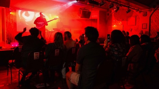 Iacopo Bertelli and Francesco Perini play in front of a socially distanced crowd at the Moth Club in Hackney, London on May 30. Milwaukee's songwriting ability also came back strong during the lockdown. Besides splitting his time as a sound technician at venues around London, he has started to write and record his fourth album.(Alberto Pezzali / AP)