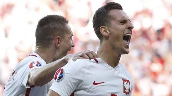 Poland's Arkadiusz Milik celebrates after scoring their first goal. (Reuters Photo) Poland's Arkadiusz Milik celebrates after scoring their first goal. (Reuters Photo)