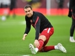 Liverpool's Jordan Henderson stretches