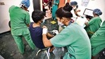 Healthworkers vaccinate a beneficiary at a hospital in Delhi(HT Photo) Healthworkers vaccinate a beneficiary at a hospital in Delhi(HT Photo)