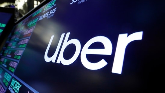 The logo for Uber appears above a trading post on the floor of the New York Stock Exchange. (AP)