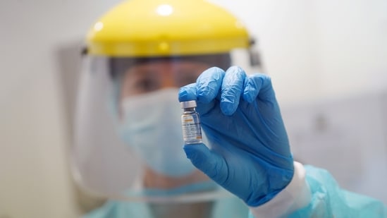 A healthcare worker shows a vial of China's SINOVAC vaccine against the coronavirus disease (Covid-19).