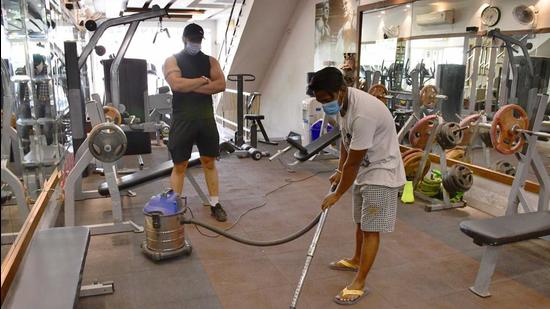 A gym owner supervising the sanitisation of his gym premises in BRS Nagar, Ludhiana, on Wednesday, (Harsimar Pal Singh/HT) A gym owner supervising the sanitisation of his gym premises in BRS Nagar, Ludhiana, on Wednesday, (Harsimar Pal Singh/HT)