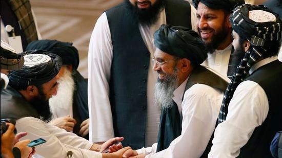 Taliban delegates shake hands during talks with the Afghan government in Doha, Qatar, on September 12, 2020. (File photo) Taliban delegates shake hands during talks with the Afghan government in Doha, Qatar, on September 12, 2020. (File photo)