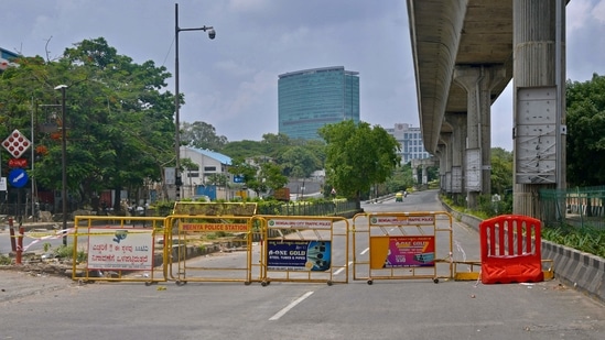 Revenue minister R Ashoka said that the daily new infections in Bengaluru is still hovering around the 2,000-mark and it should fall below the 500 for unlocking the city. In picture - Deserted street in Bangalore during the lockdown.(AFP)