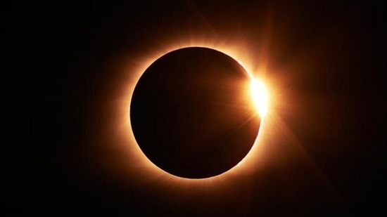 A solar eclipse is witnessed when the Earth gets engulfed in the shadow the moon casts when it covers the sun, blocking sunlight.(Unsplash)