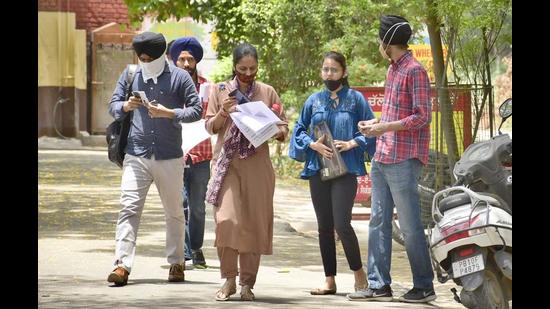 Candidates coming out from the examination centre at Government Senior Secondary School, Bharat Nagar, in Ludhiana on Wednesday. (Harsimar Pal Singh/HT)