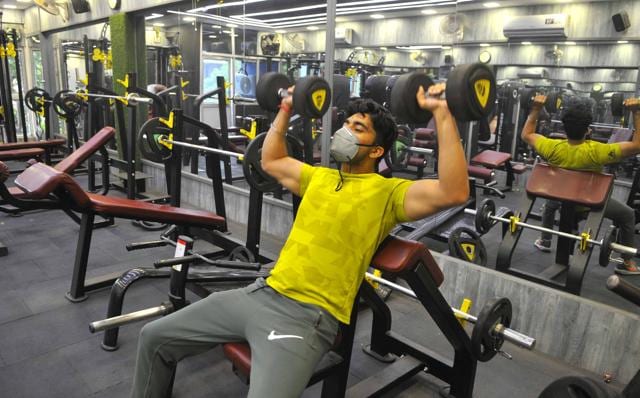 A man exercising at a gym in Sector 32, Chandigarh, on Wednesday. (KESHAV SINGH/HT) A man exercising at a gym in Sector 32, Chandigarh, on Wednesday. (KESHAV SINGH/HT)