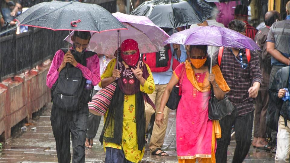 People walk in rain at Chhatrapati Shivaji Maharaj Terminus (CSMT), in Mumbai on Tuesday, June 8. (HT Photo) People walk in rain at Chhatrapati Shivaji Maharaj Terminus (CSMT), in Mumbai on Tuesday, June 8. (HT Photo)