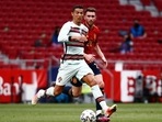 Portugal's Cristiano Ronaldo in action with Spain's Aymeric Laporte.