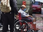 Mehul Choksi is taken in a wheelchair to the magistrate's court by police after his arrest for illegal entry into Dominica, in Roseau on June 4.