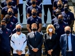 French President Emmanuel Macron, center, France's coach Didier Deschamps, center left, French President's wife Brigitte Macron, center right, French Football Federation (FFF) president Noel Le Graet, right, pose for a group picture with France's players(AP)